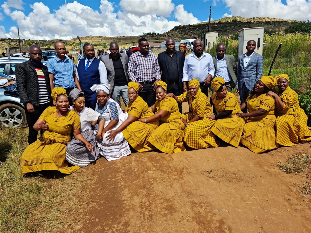 Group of Letsoisa great-grandchildren gathered outdoors in traditional attire